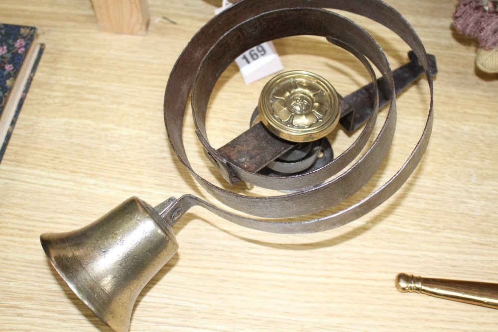 Two antique wrought iron and brass shop bells, height 33cm and 24cm